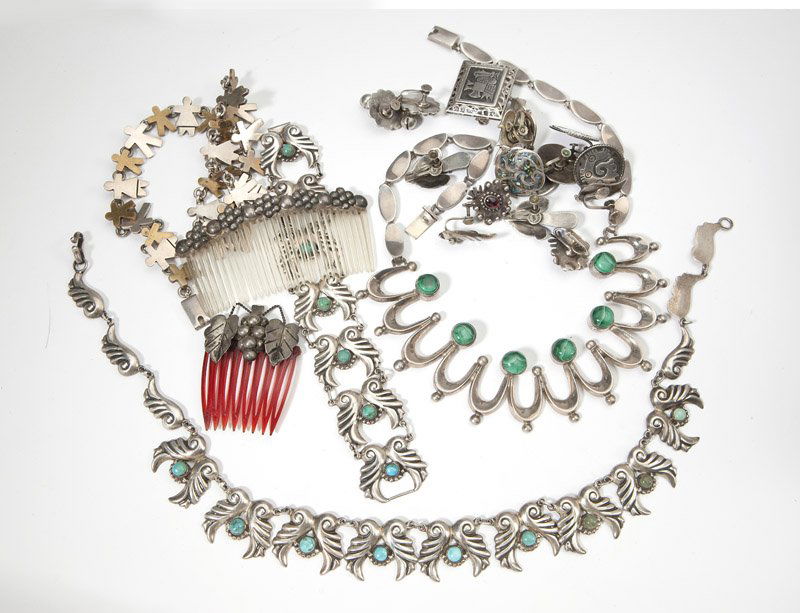 A group of Mexican sterling and costume jewelry: Of mixed metals, with some of sterling and some costume: seven pairs of screw-back earrings; one pendant; 8 haircombs; two necklaces; and one matching necklace, bracelet, and earring set; 22 pcs, est: