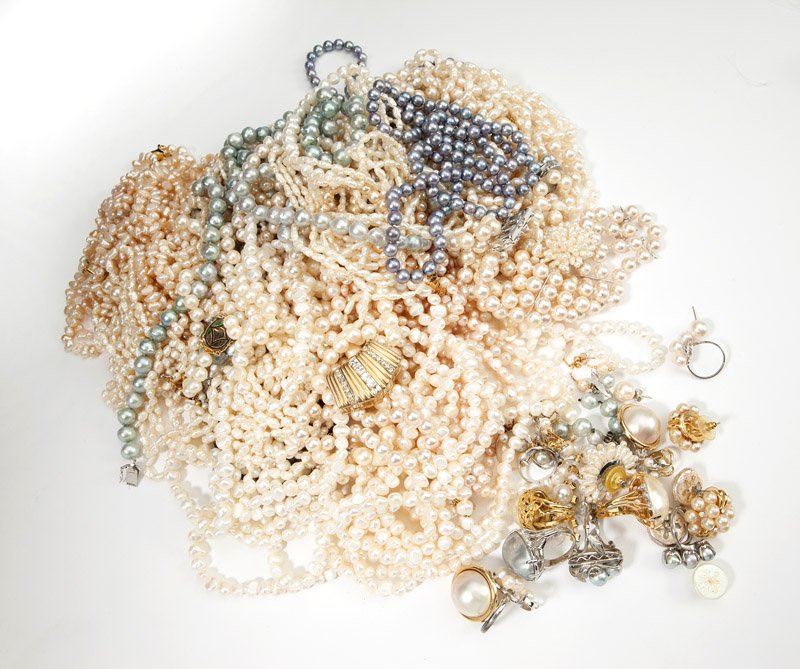A collection of pearl jewelry: Eighteen necklaces in both single and multi-strand, of cultured and freshwater pearls in white, pink, and grey colors with multi karat gold, sterling, and costume clasps, two different notable clasps 