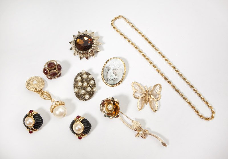A collection of vintage costume jewelry: Necklaces, bracelets, earrings, rings and brooches from various time periods, with highlights including signed pieces by Trifari, Monet, Emmons, Boucher, Ciner, Hobe, and Napier; approximately 93 pcs,
