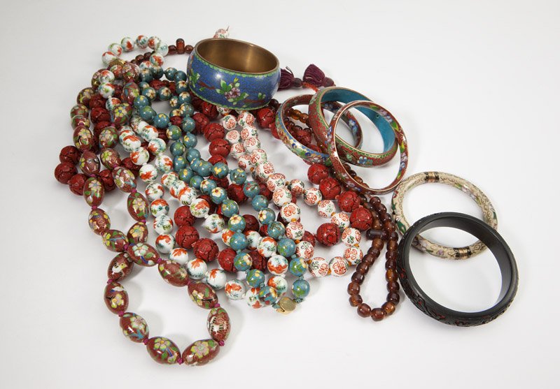 A collection of Chinese cloisonne jewelry: Including brightly colored and intricately detailed beaded necklaces, pendants, and bracelets in cloisonne and porcelain, as well as tasseled beads, approximately 50 pcs, est: $300/500 Provenance: Pro