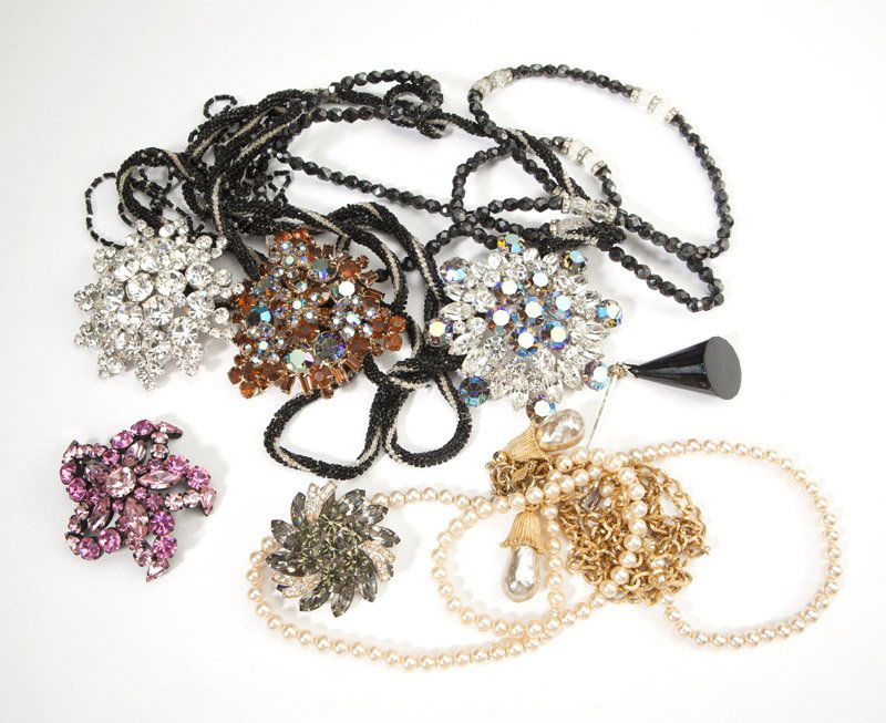 A collection of vintage costume jewelry: Including rhinestone and crystal beaded necklaces, earrings and brooches from various time periods, with highlights including signed pieces by Weiss, Regency, Eisenberg, Eisenberg Ice, and Trifari; ap