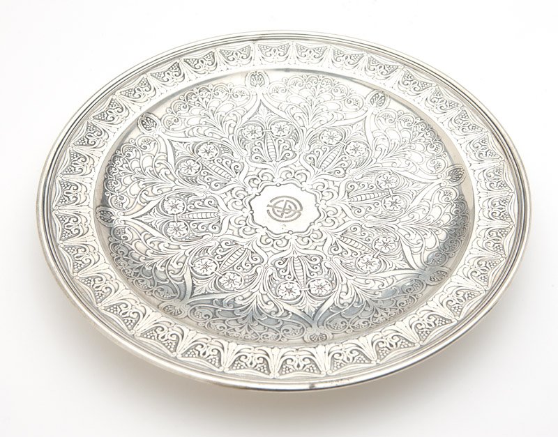 A Tiffany & Co. sterling silver footed plate: 1907 - 1947 (Directorship of John C. Moore II), marked ''Tiffany & Co. / 17266 H I Makers 490 / Sterling Silver / 925-1000 / M'', circular, with banded rim, the flat border and shallow dished center r