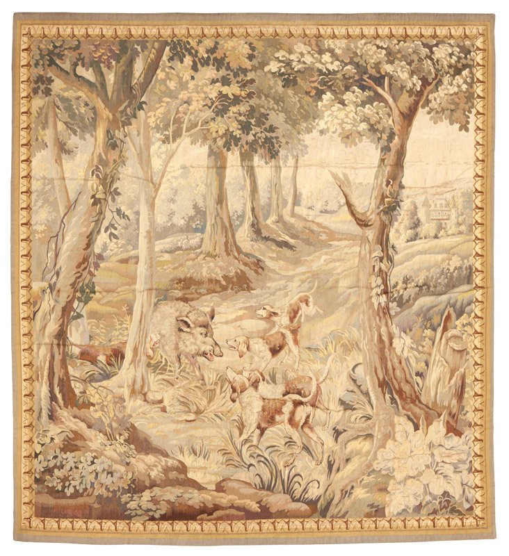 An Aubusson tapestry: 19th century or earlier, signed in the weaving lower left ''M. Lemasson / Aubusson'', depicting dogs baying at a boar in a forest landscape with a castle in the distance, 77.75'' H x 74.5'' W, est: $1