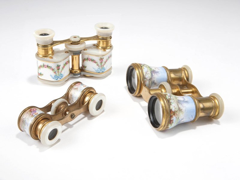 Three French opera glasses: The first: labeled ''James Hachett Optician, 42 Patrick St, Cork,'' in brass and mother-of-pearl with an enameled pastoral scene (2'' H x 3.75'' W x 1.25''D); the second: in brass and mother-of-pearl