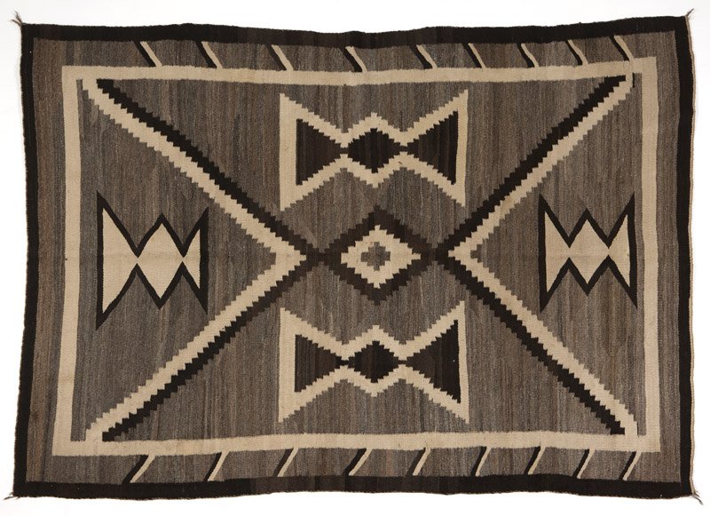 A Navajo regional rug: First quarter 20th century, a JB Moore Crystal-type weaving in variegated gray, cream and black, 7'11'' H x 5'10'' W, est: $600/900 Provenance: Private Collection, Orange County, CA