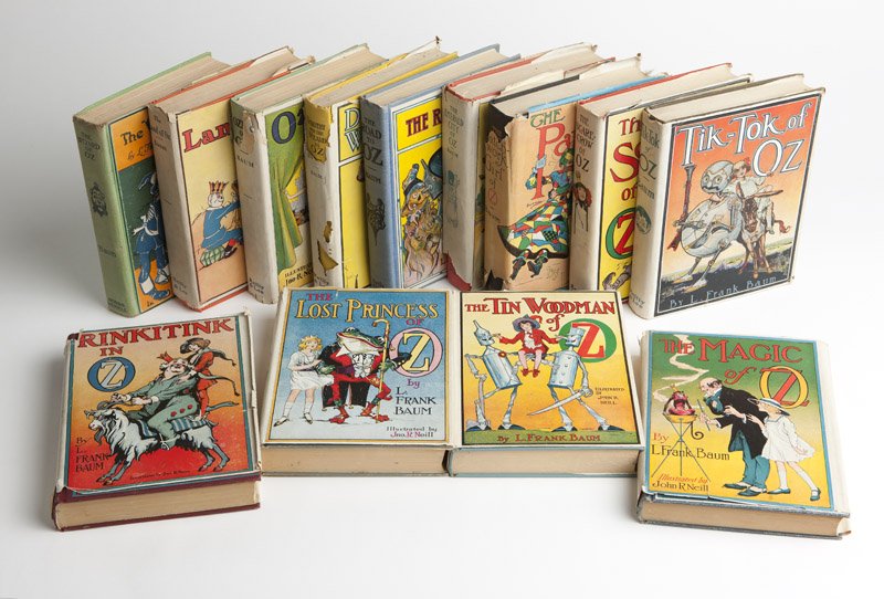 A group of 13 L. Frank Baum books, ''Wizard of Oz'' &: Comprising: ''The Wizard of Oz'', this edition printed by the Bobbs-Merrill Company, Indianapolis, copyright Braunworth & Co., Inc., Brooklyn, 1903, hardbound, with seven color plates, illustrated by