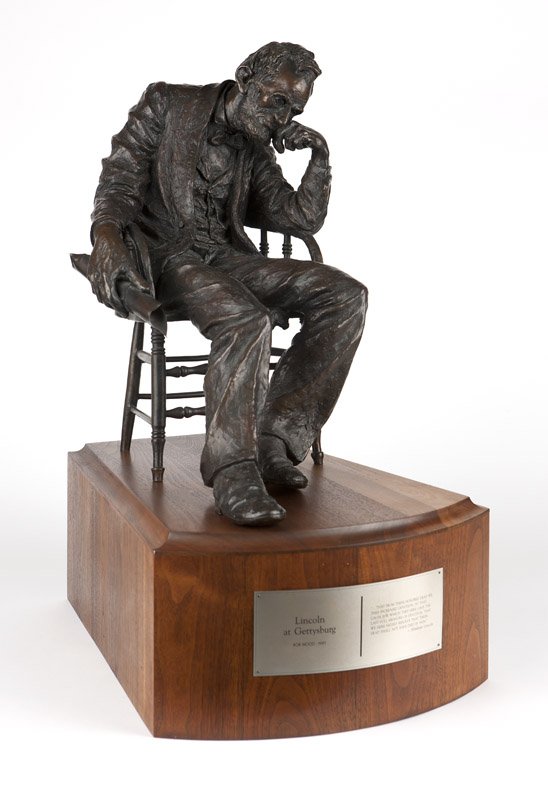 Bob Wood (1925-1999 Montana): Inscribed and dated ''/50 (c) Bob Wood 1981'', titled on plaque ''Lincoln at Gettysburg'', from the edition of 50, a bronze sculpture depicting a seated President Abraham Lincoln deep in thought, hold
