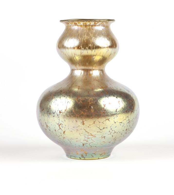 A Loetz iridescent ''oil spot'' art glass vase: Late 19th / early 20th century, unmarked, a double-gourd form art glass vase in the ''Candia Papillon'' decor, 8.5'' H x 6.25'' Dia., est: $800/1200 Provenance: Collection of California State Governor