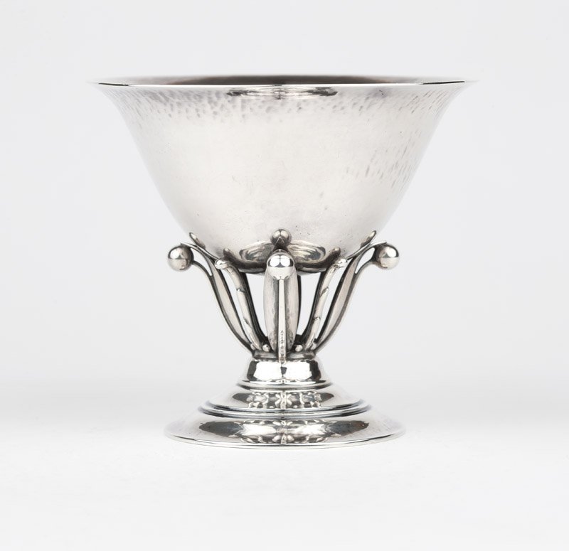 A Georg Jensen sterling silver compote: Circa 1926-1932, designed by Johan Rohde, with maker's mark and designer's mark, further marked ''Sterling'', ''Denmark'' and ''Gi / 925 / s'', pattern number 17A, the slightly flared circular body ra