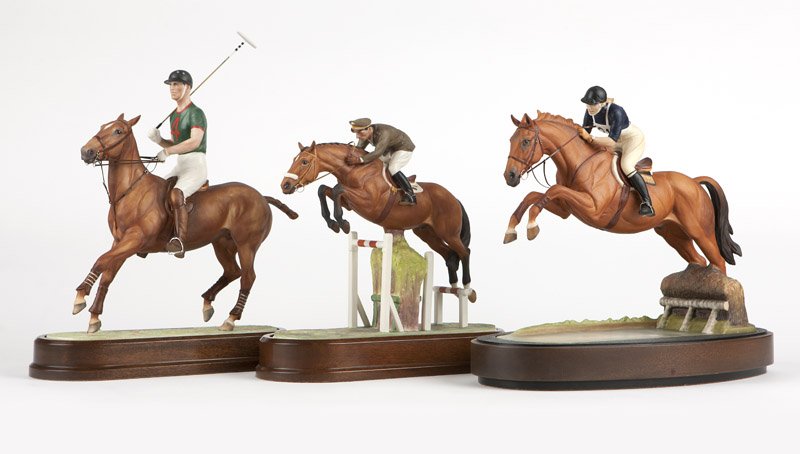 Three Royal Worcester porcelain equestrian groups: Introduced 1963 - 1972, each with maker's marks, dated and titled to underside, three polychrome painted porcelain models depicting a horse and rider modeled by Doris Lindner, each with a wooden base