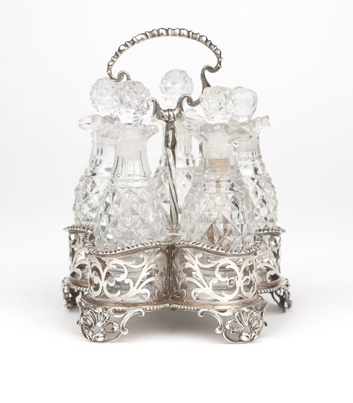 A George III sterling silver cruet stand: 1767, London, with maker's mark ''EA'' within a diamond for Elizabeth Aldridge, with a bead and reel-topped handle over a twisted standard centering a five-part platform with four pierced sides; the f