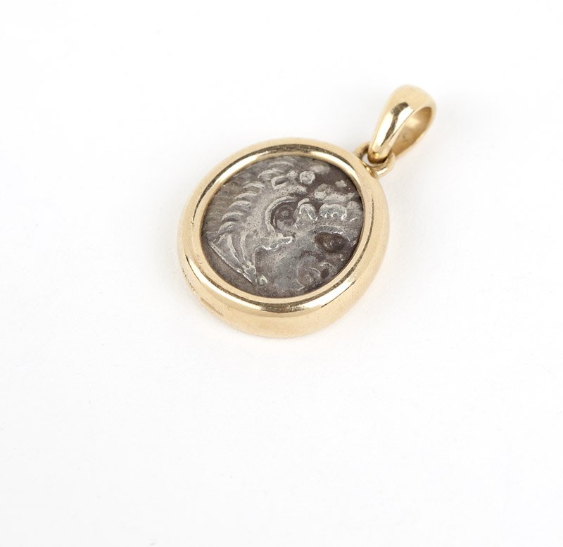 A gold and coin pendant, Bulgari: Stamped Bvlgari, 750, Made In Italy, Alexander III The Great 336 - 326 BC, 18K gold bezel with metal coin center pendant, with box, est: $500/700