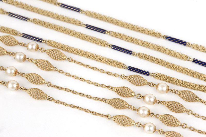 A set of two fancy link long necklaces: 18K gold, one chain with twisted wire sectionals and cultured pearls, the other with Byzantine links and blue cylinder enamel sectionals, 42 1/2'' and 40'', 111.2 gms gross, est: $1800/2500 Provenance