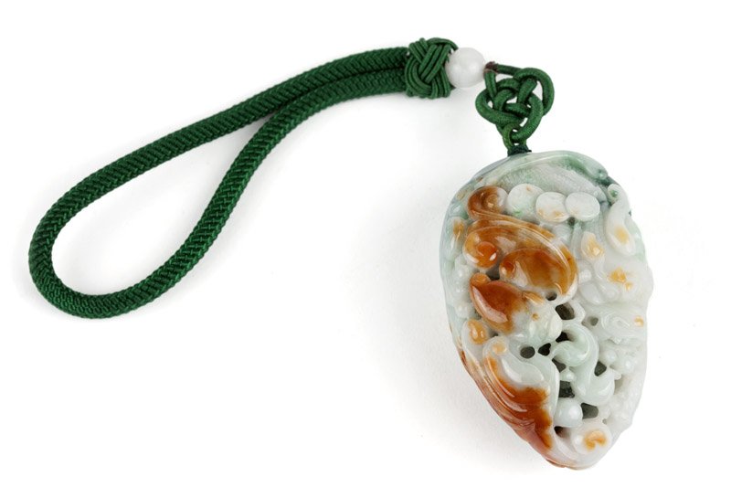 A carved jadeite jade tassel on cord: A mottled green and russet carved tassel of a dragon and bat with coins, accompanied by GIA report #2161914463 dated January 6, 2015 stating: Translucent To Opaque, Mottled White, Grayish Green and Or