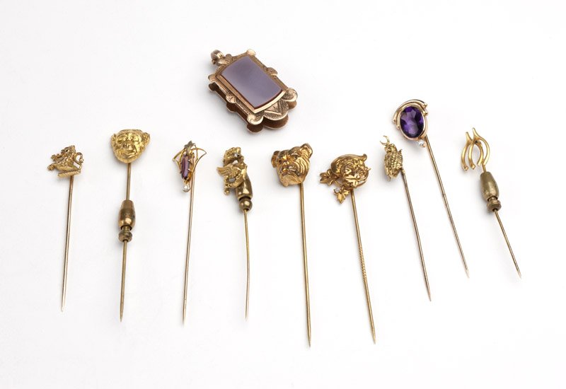 A collection of gold and gold-filled stick pins: A set of six 10K gold and gem stick pins, three gold-filled stick pins and one gold-filled and stone Victorian locket, 12.9 gms gross of gold items only, 10 pcs, est: $300/500