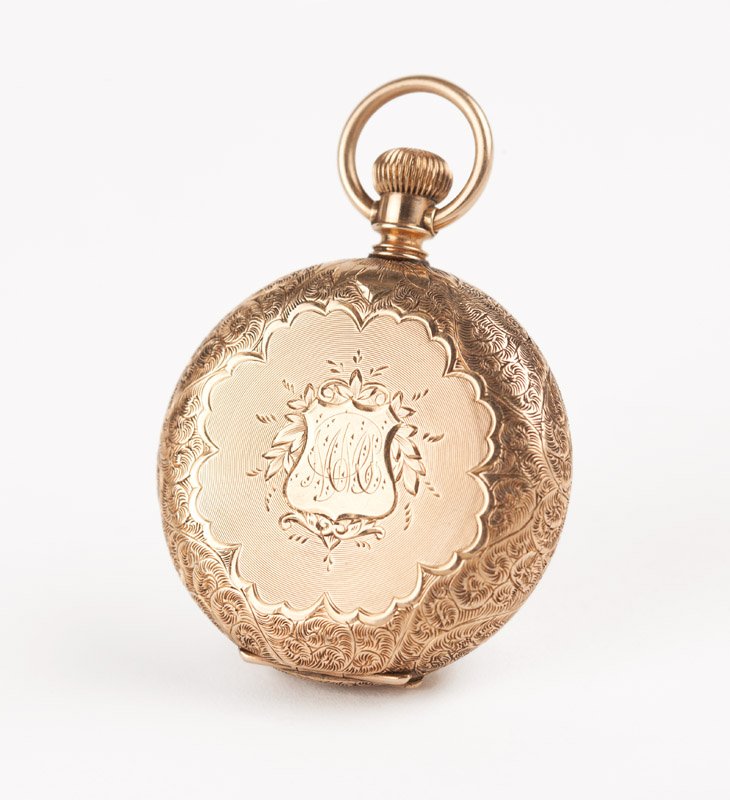 A lady's Elgin gold hunter case pocket watch: A 14K gold, circular white porcelain dial with black Roman numeral hour markers and black minute track, sub-seconds dial, signed ''Elgin'', attached to a stem wind and lever set movement, Number: 2259
