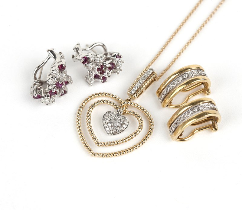 A group of diamond and gold jewelry: A pair of ruby, diamond and white gold earrings, a pair of gold earclips with diamond accents and a diamond and gold heart pendant with chain, 18.4 gms gross, 6 pcs, est: $600/800 Provenance: Property