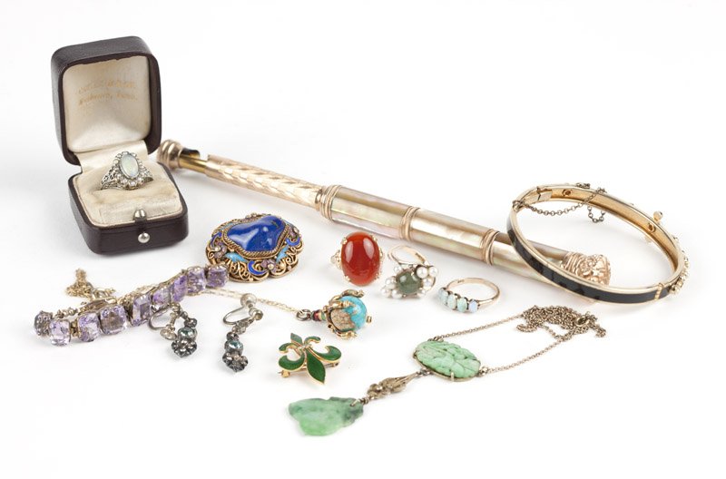A group of antique jewelry: Of various golds: four stone rings, two brooches, one pendant on gold-filled chain and a gold-filled pair of opera glasses handle; and in costume: a pendant necklace, two bracelets, one vermeil brooch