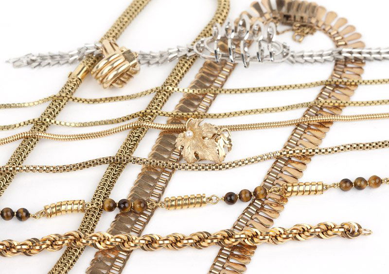A collection of gold jewelry: Of 18K and 14K gold, with two pairs of earclips, four bracelets and eight necklaces, one with tiger's eye beads, 212.5 gms gross, 16 pcs, est: $2500/3000 Provenance: Property from a Pasadena Collector