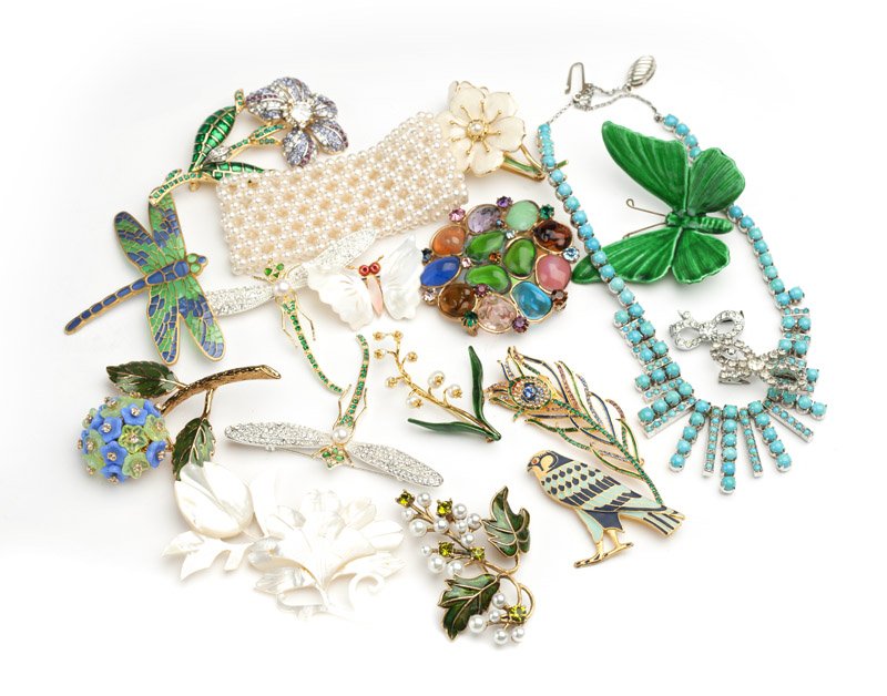 A large group of costume jewelry: Including 17 brooches, one necklace, five pairs of earclips, and faux pearl accessories, 33 pcs, est: $100/200
