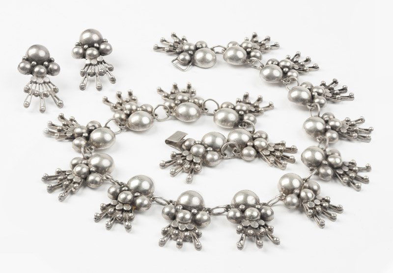 A silver set, Los Ballesteros: Stamped Los Ballesteros, Sterling, Hand Made, Taxco, half-sphere and wire drop necklace with matching screw-back earrings, hook closure, 15 1/2'' and 1 3/8'', 107.8 gms, est: $200/400 Provenance: Prop