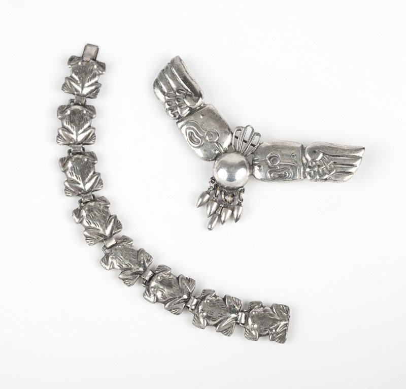 A brooch and frog bracelet, Spratling, Silson: Stamped Spratling of Mexico Silson Inc., a silver plated double eagle brooch together with a frog sectional bracelet with box clasp, 4 3/4'' x 2'' and 6 3/4'', est: $150/250 Provenance: Property from