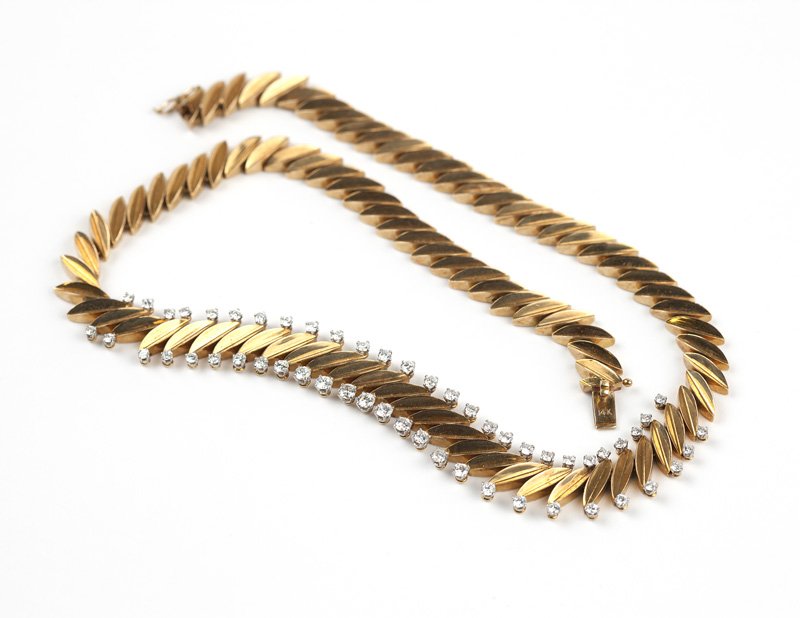 A gold and diamond necklace, Van Cleef & Arpels: Signed Van Cleef & Arpels, #72120, 14K yellow gold, of graduating marquise-shaped sectionals, trimmed with 54 full-cut diamonds totaling approximately 3.05 cts., graded F-G color and VS clarity, 16 3/