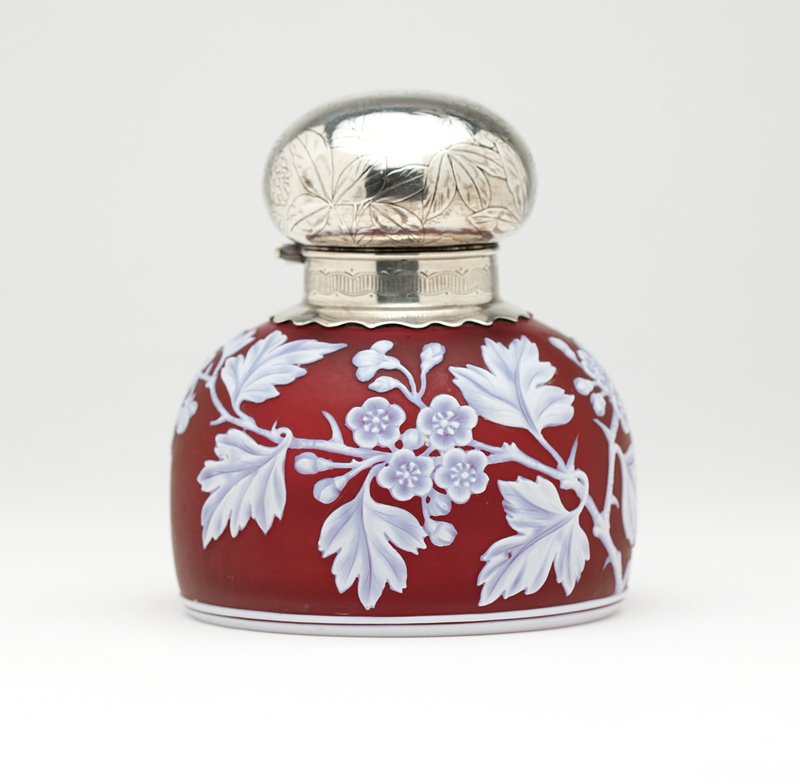 Webb cameo glass & Gorham sterling silver inkwell: 1896, with maker's mark, further marked ''Sterling'', glass unmarked, attributed to Thomas Webb & Sons, the rounded hinged silver lid chased with clover flowers and monogrammed ''LS'', the domed circu