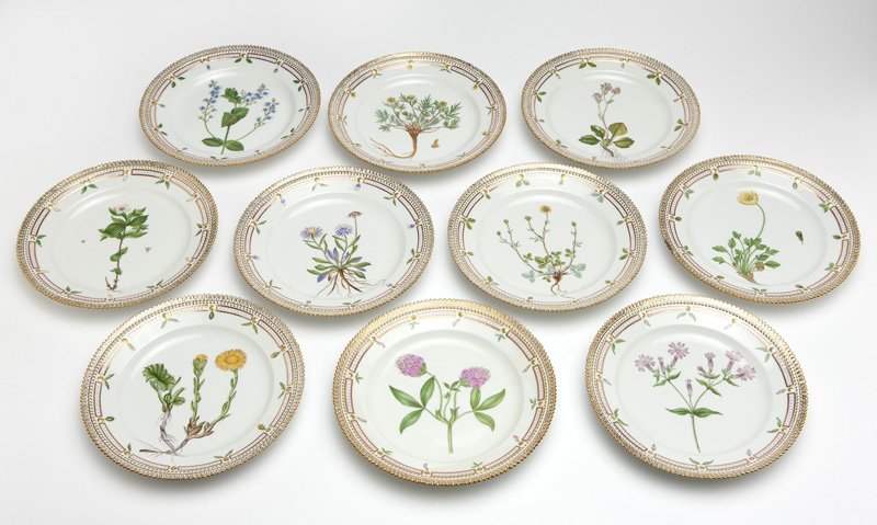 Royal Copenhagen ''Flora Danica'' luncheon plates: 1956-1960, each with blue wave and green printed maker's mark, with inscribed green pattern number ''20'' and shape number ''3550'', a set of ten white porcelain luncheon plates, each with a gilt-high