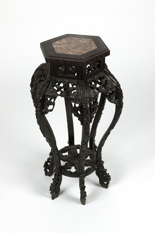 A Chinese export carved hardwood plant stand (1 of 3)