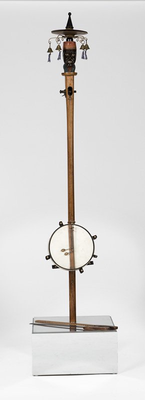 A carved black Americana one-man band (1 of 2)