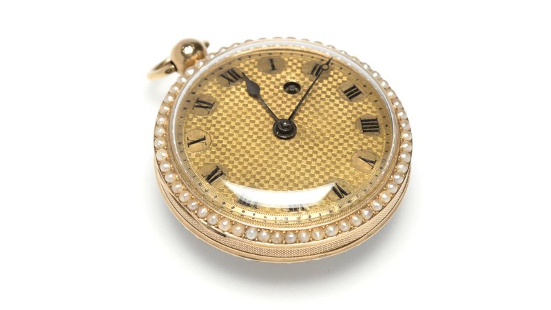 A gold open face pocket watch (1 of 2)