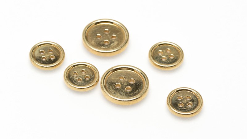 A set of six gold buttons (1 of 2)