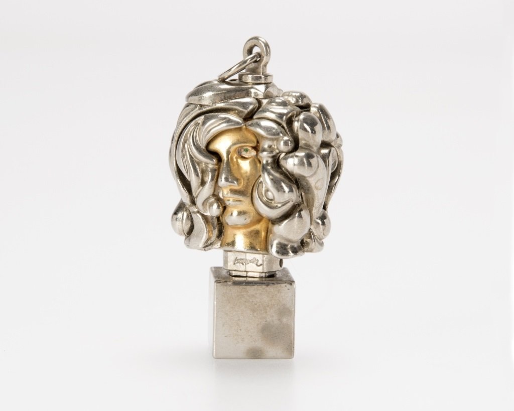 Miguel Ortiz Berrocal (1933-2006 Spanish): ''Micheline X'', circa 1975-1976, of the edition of 10,000, portrait head, a chrome-plated and natural brass puzzle pendant with enameled eye, signed: Berrocal, 2.125'' H x 1'' W x 1'' D, est: $300/50