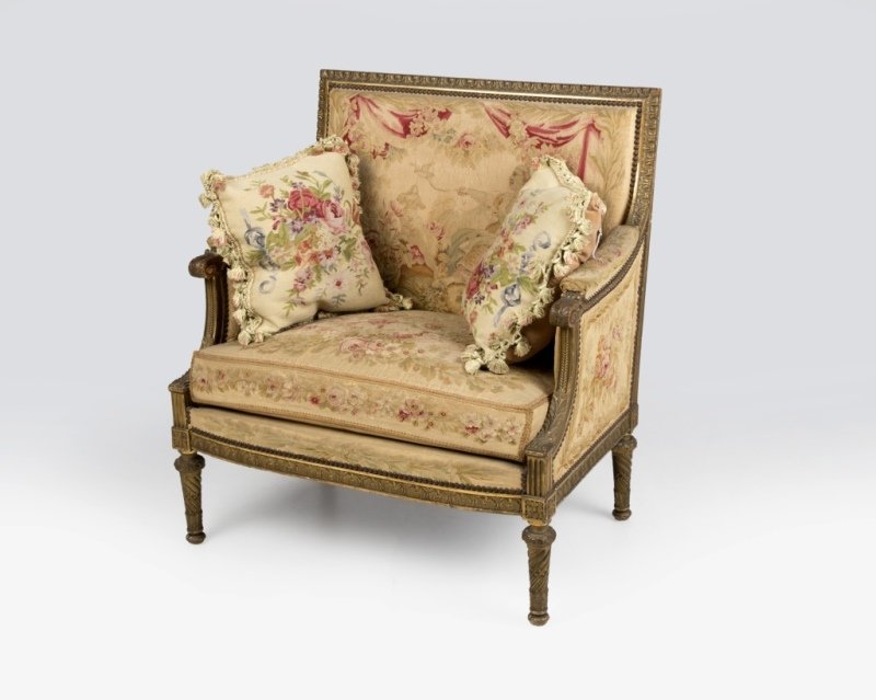 A Louis XVI-style carved giltwood settee (1 of 2)