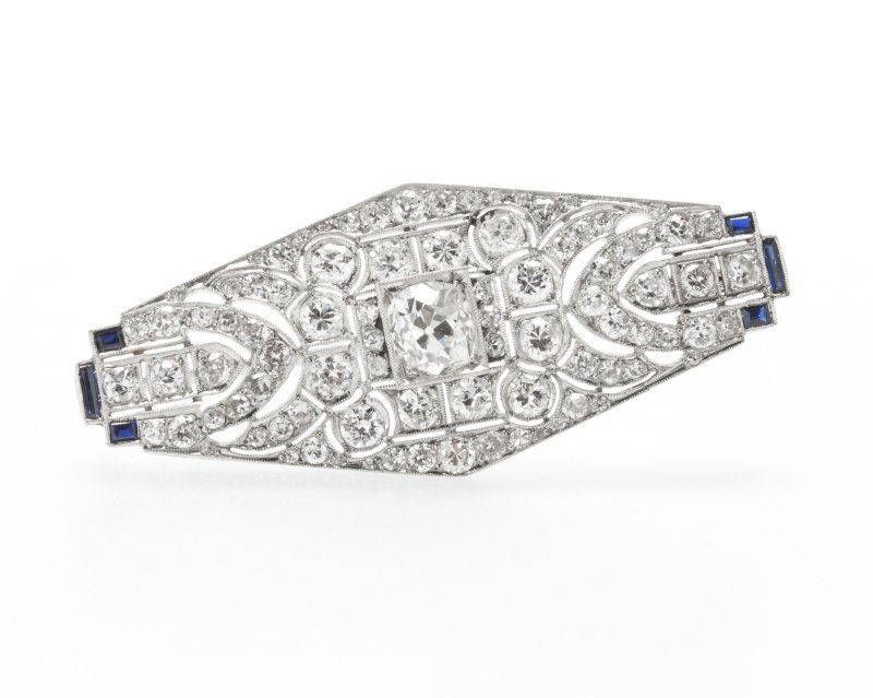 An Art Deco platinum, diamond and sapphire brooch (1 of 2)