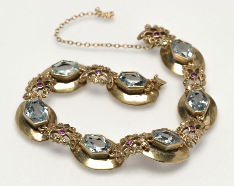 A gold, ruby, blue stone and gold bracelet (1 of 2)