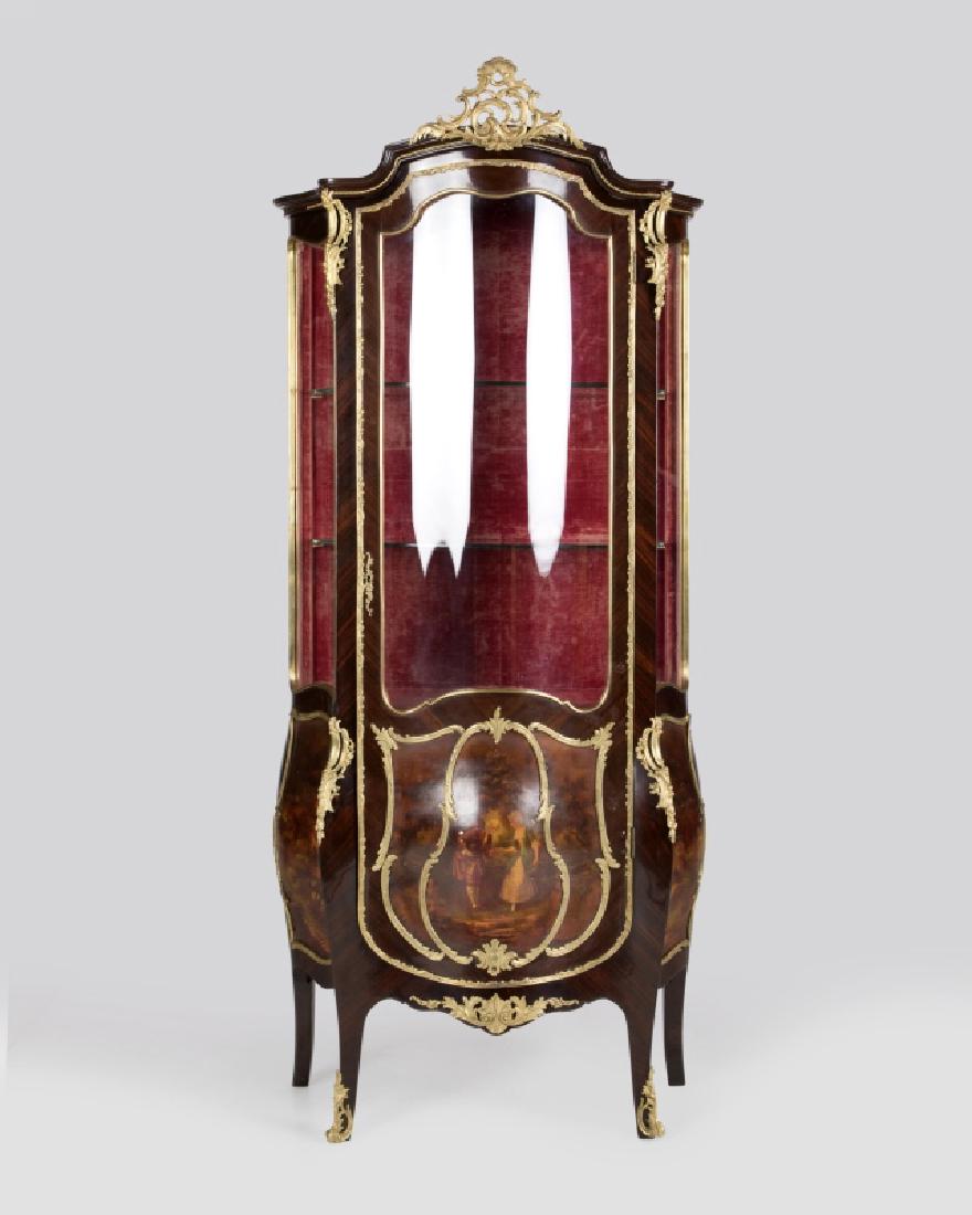 A Louis XV-style Vernis Martin vitrine cabinet: Late 19th/early 20th century, Vernis Martin panel signed lower right ''Albertini'', the pierced foliate gilt-bronze crest atop the serpentine-outline glazed cabinet fitted with a hinged glazed and han