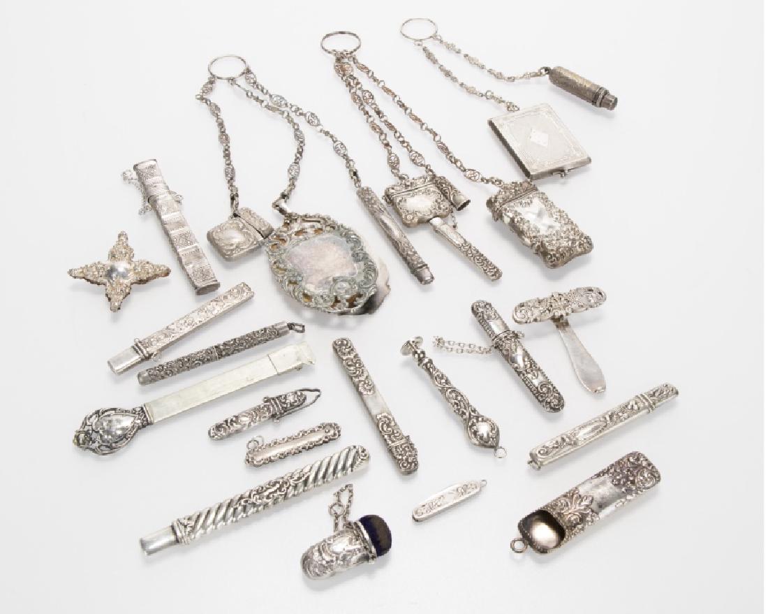 A group of chatelaines and notions: Circa late 19th/early 20th century, including three chain chatelaines and other sewing notions and useful items including a pencil, hem gauge, seal, needle case, memo pad, glove hooks and various othe