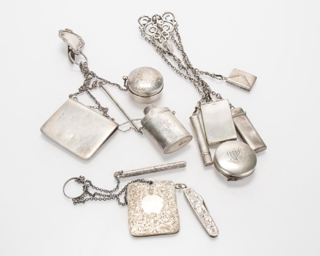 A group of chatelaines: Circa late 19th/early 20th century including note pads, a seamstress tape measurer, a fruit knife, needle case, pencils, powder jar, and others, most stamped for sterling and some with foreign hallmar