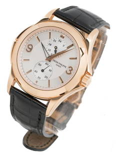 Patek Philippe Calatrava Travel Time 5134R w/ Papers: Patek Philippe Calatrava Travel Time 18k rose gold gent's wristwatch, reference number: 5134R-011, calibre: 215 PS FUS, movement: 3087429/4264522, two-zone dial with rose gold Arabic numerals, 18