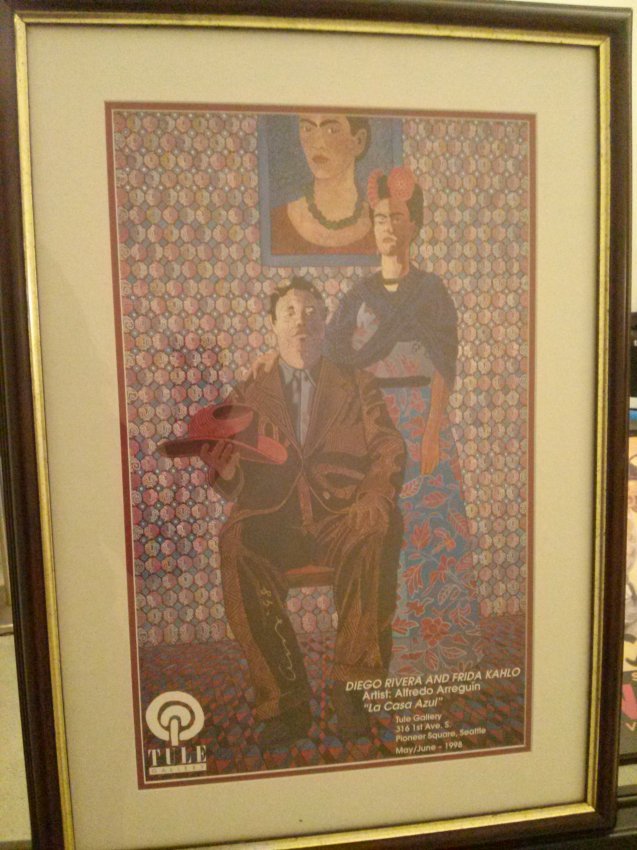 Alfredo Arreguin,Diego and Frida Kahlo, signed Exhibit: Alfredo Arreguin, Exhibit poster of "La Casa Azul" pictured is Diego and Frida Kahlo with one of Frida's famous painting of herself on the wall behind them. This print is signed by Alfredo Arreguin, h