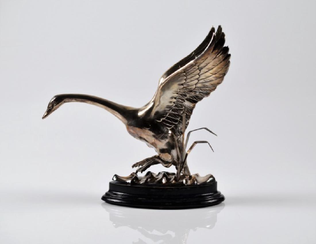 SPANISH SILVER DEPOSIT FIGURAL SCULPTURE: Modelled as a goose surrounded by bullrush taking flight. 20th C. Hallmarked. L: 10 in. (26 cm.)