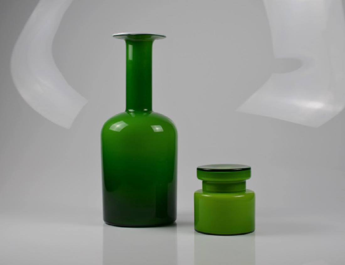 LARGE HOLMMEGARD VASE T/W A STORAGE JAR: Otto Brauer Glass Vase for Kastrup Holmegaard. Both with green glass and white interiors. Vase bearing paper label. H of vase: 17 1/4 in. (43.8 cm).