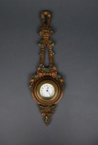 New Haven carved wall clock: white enameled face with carved floral design.