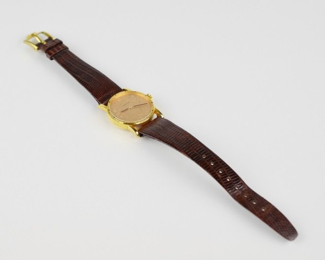 CORUM 18K GOLD ZODIAC WATCH: Swiss made jewel movement on Hirsch band. Astrological signs obverse, Pisces at reverse.