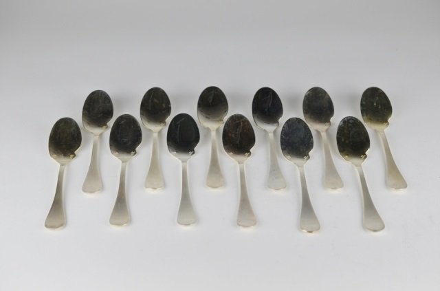 SET OF TWELVE CHRISTOFLE SILVER PLATE SPOONS: includes two original boxes. L of each: 6 3/4 in. (17 cm.).