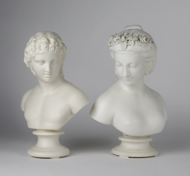 TWO PARIAN BUSTS: female with flowers in her hair together with a young male. Both unsigned. H of female: 10 in. (26 cm.) H of male: 93/4 in. (25 cm.)