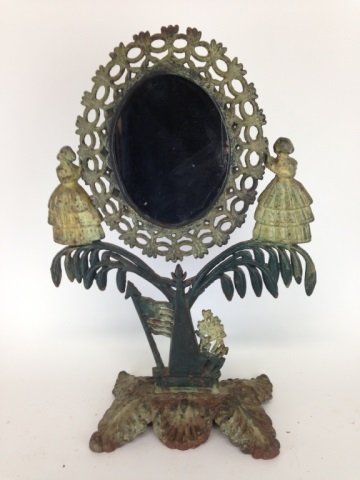 ANTIQUE CAST IRON FIGRAL SWING MIRROR: With female figures supporting mirror standing on foliage and American flag. Minor rusting to base H: 54 cm. (21 in.)
