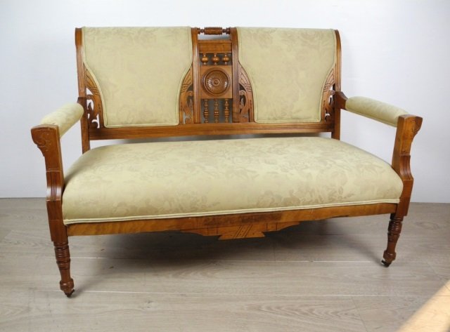 VICTORIAN CARVED WALNUT SETTEE: 32 3/4" X 50"